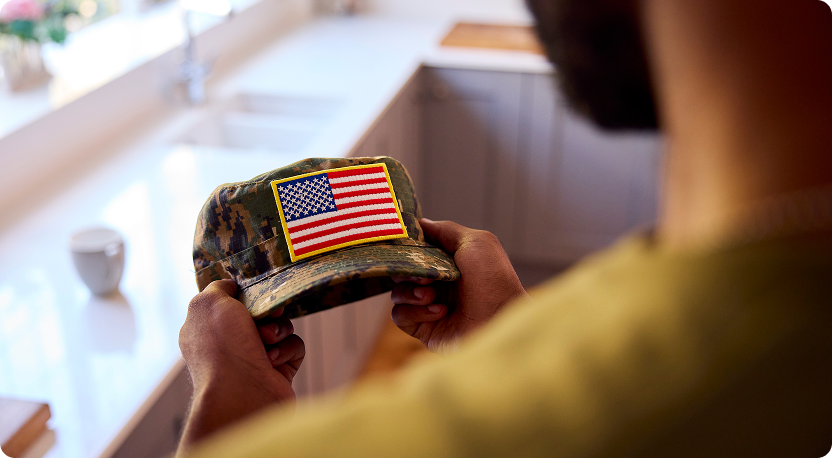 Man Looking at Cap